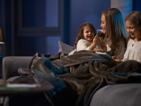 family keeping warm on cool night